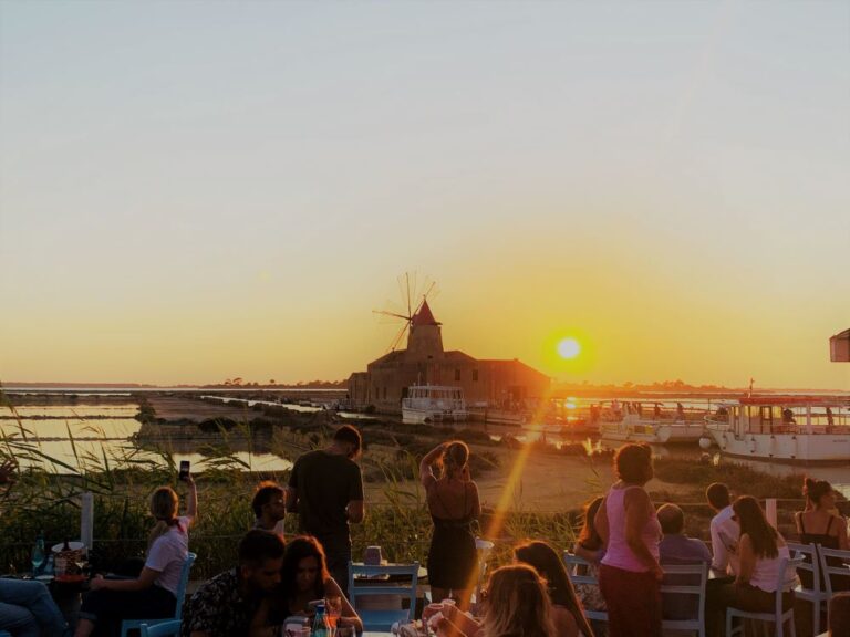 Having an earlier dinner and watching the sunset over the salt lakes of Marsala which overlooks the island of Mozia, Western Sicily