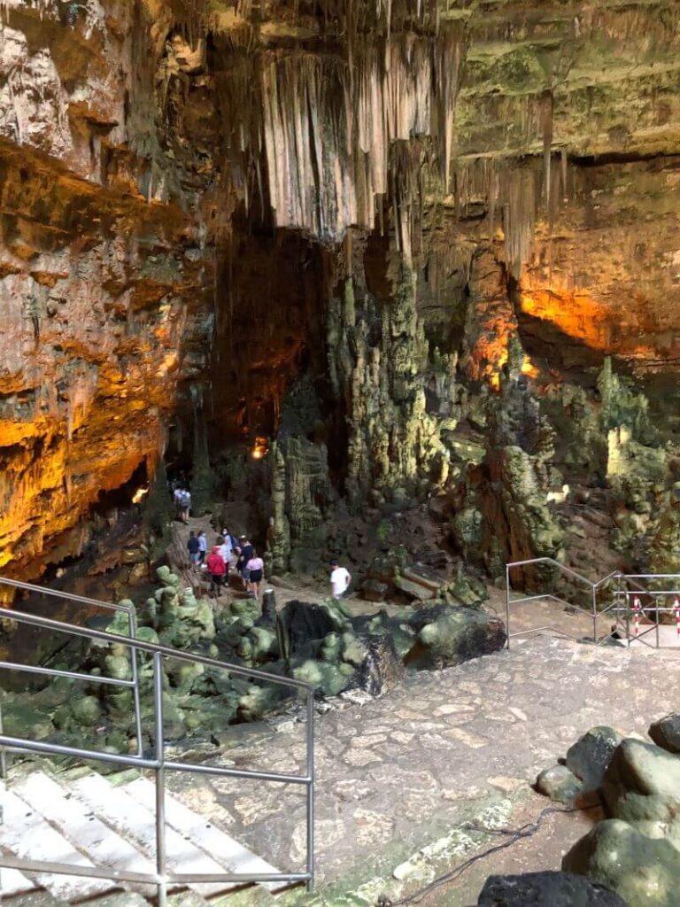 People in an underground cave with natural rock formations