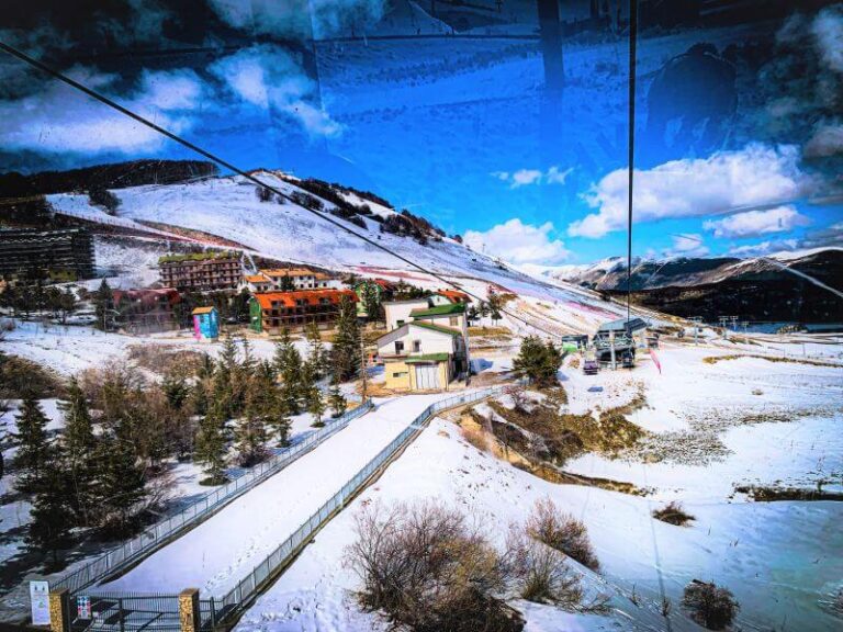 View of a winter resort hotel from a ski cabin in Roccaraso, a low-budget winter destination in Italy