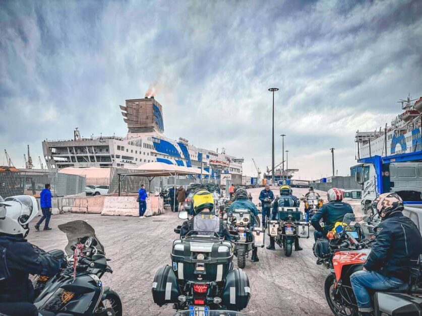 A group of motorcyclists waiting to board a ferry in Palermo.