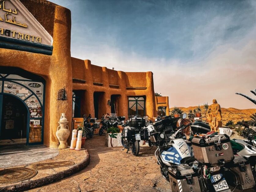 Motorcycles parked in front of a troglodyte hotel in Matmata, Tunisia