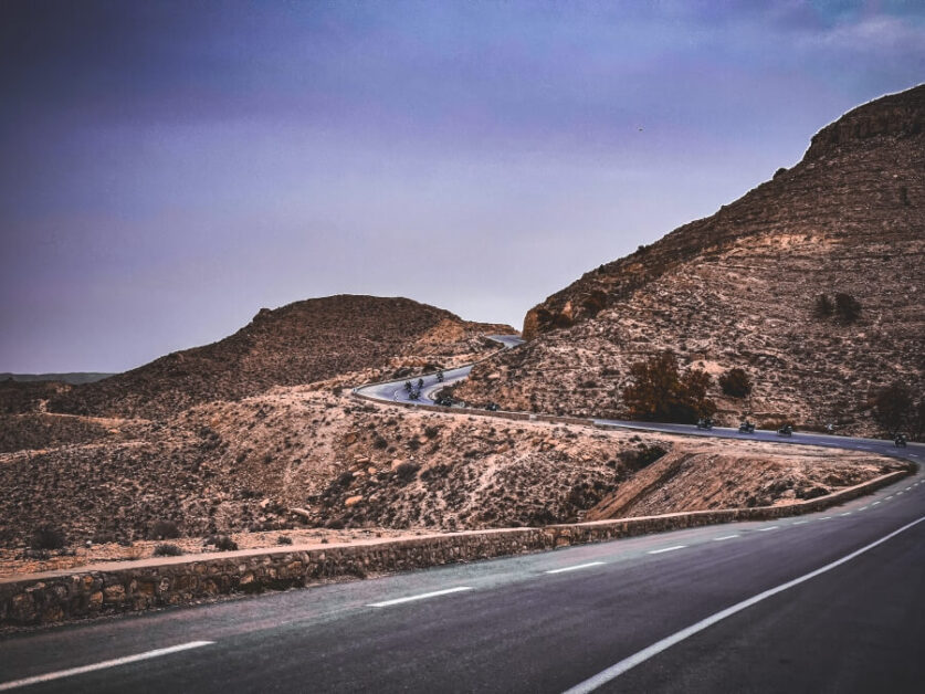 A winding mountain road in a desert landscape in Tunisia