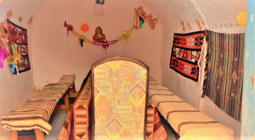 Dining room of a cave home with traditional decorations