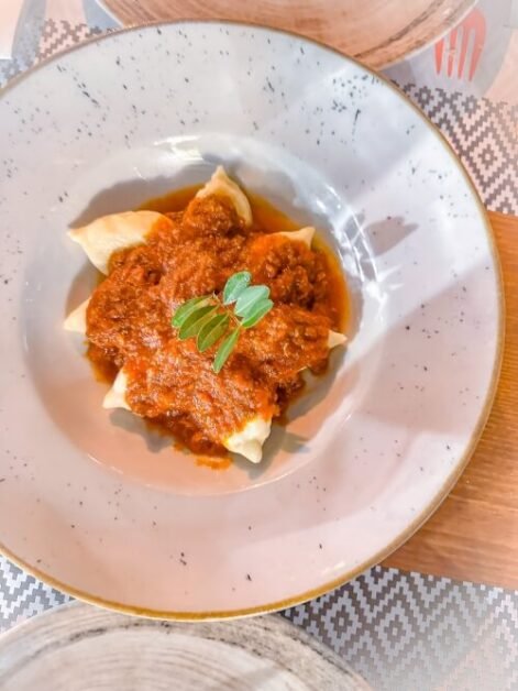 A pasta dish called culurgiones with tomato sauce from Sardinia