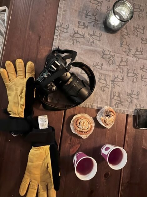 Items to be packed for a trip to a winter destination, laid out on a table