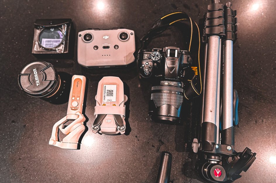Several camera gear set on a black marble surface