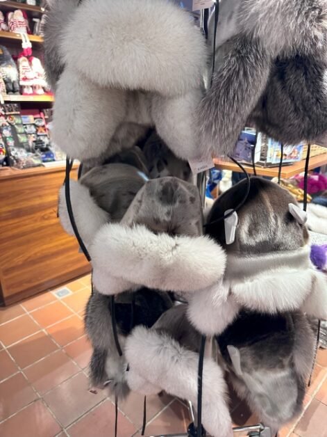 A standing rack with reindeer trapper hats